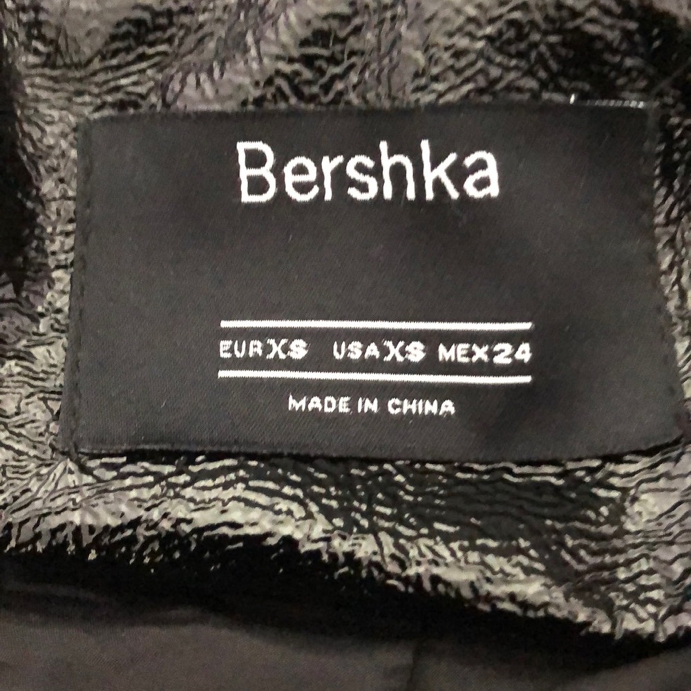 Shiny black bomber jacket, excellent condition.